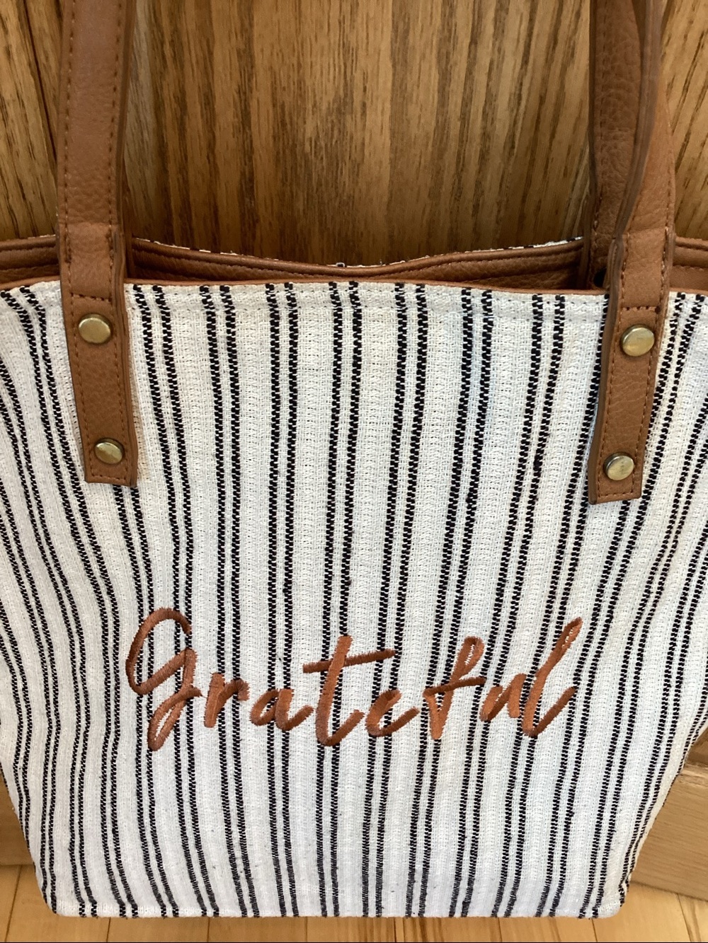“Grateful” blue and white striped tote bag with tan straps